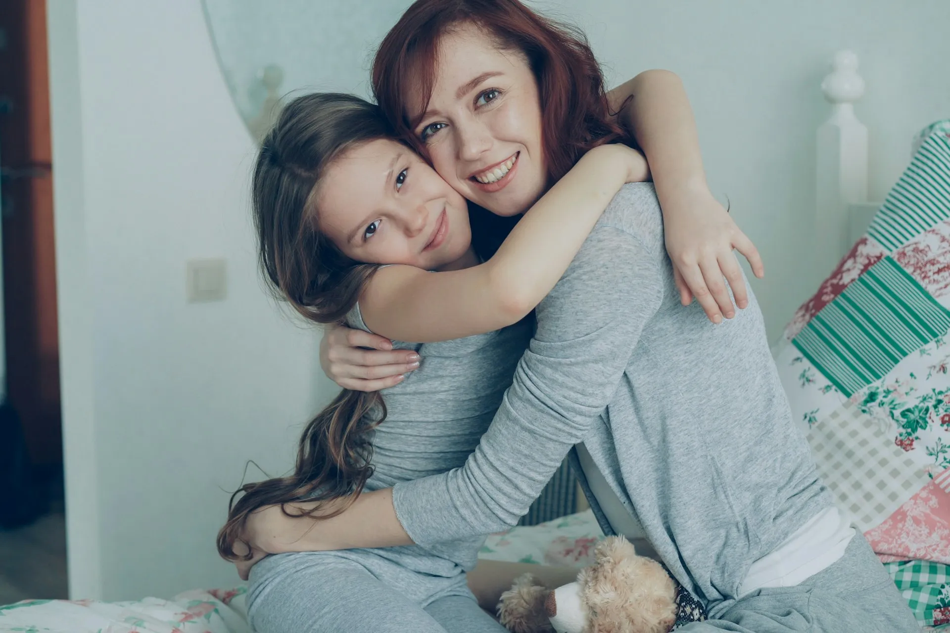 Mother and daughter sharing a warm hug